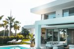 white concrete building with swimming pool